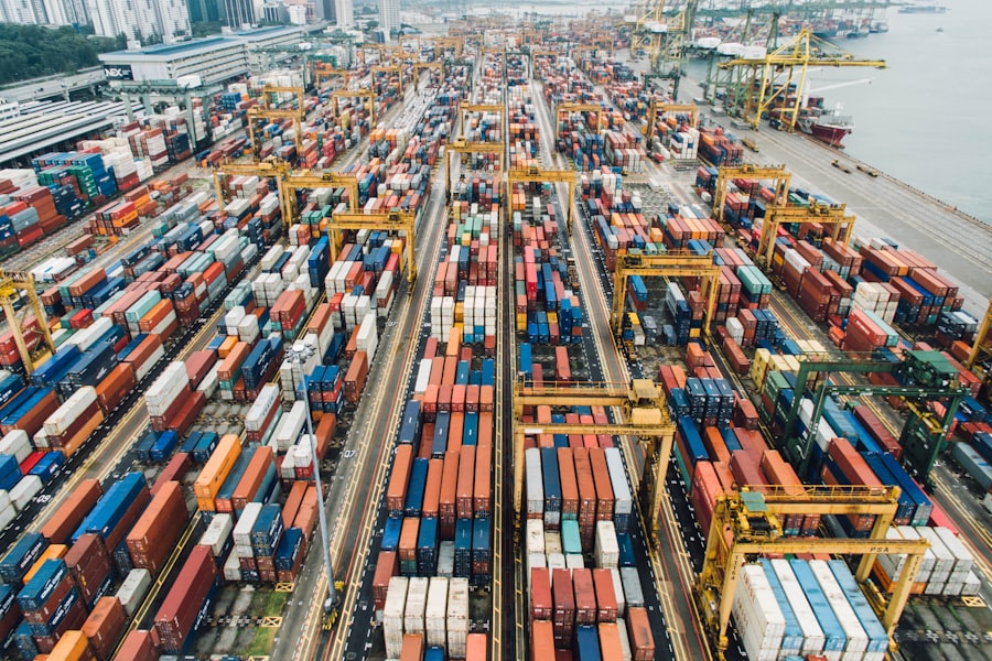 A factory floor with a sourcing agent inspecting product samples.